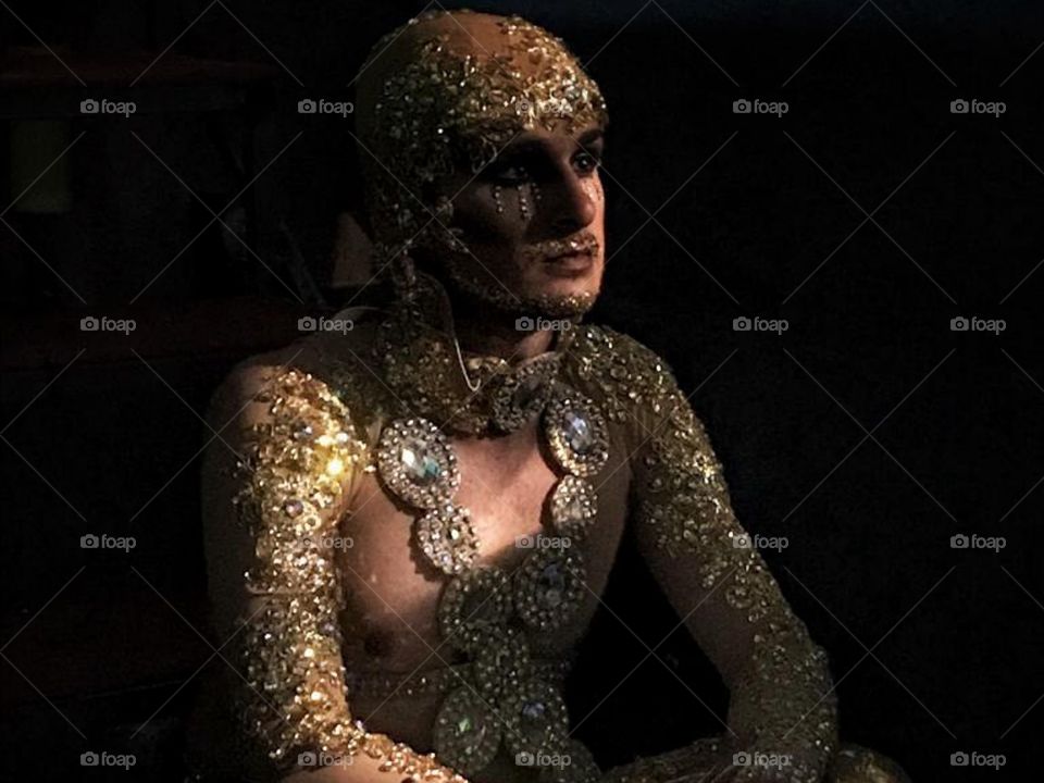 Photo of a men preparing himself to a portuguese festival.