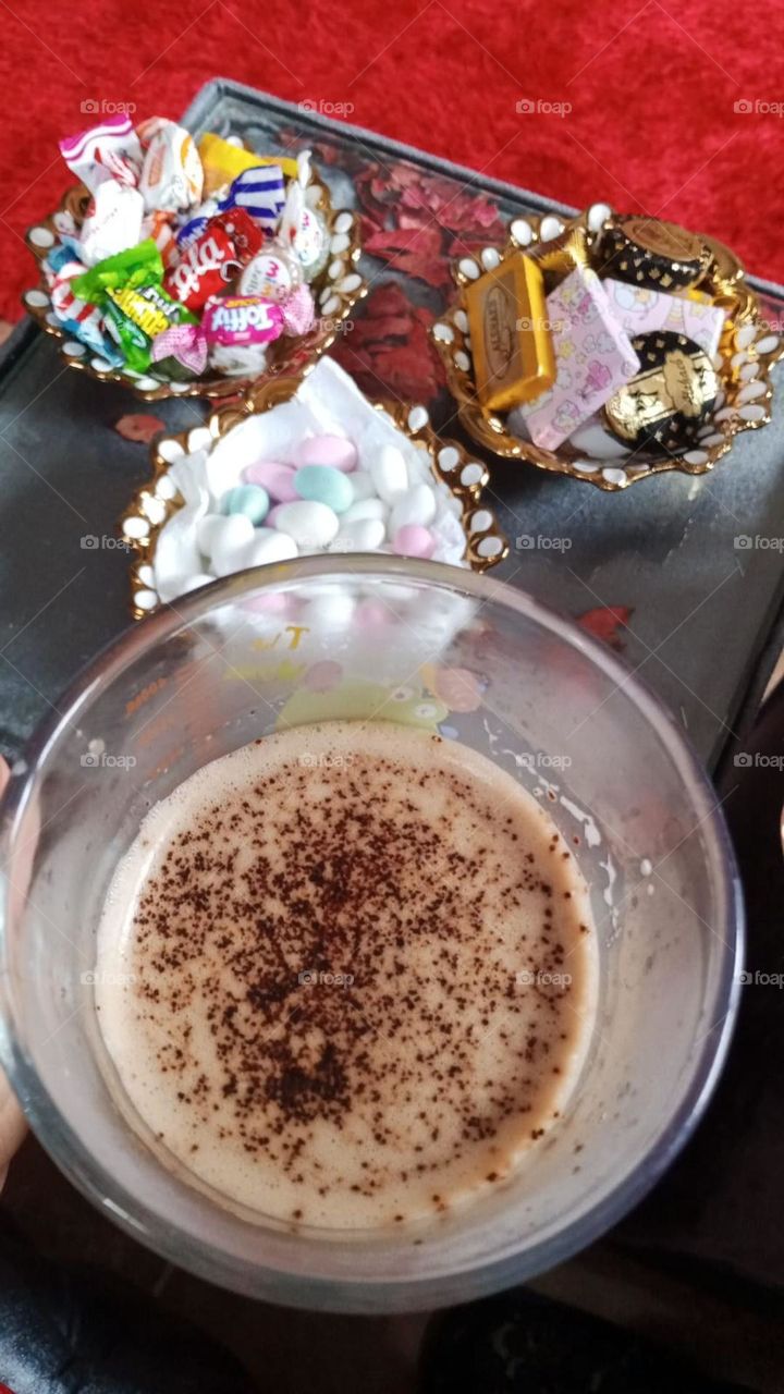 A cup of coffee with dessert