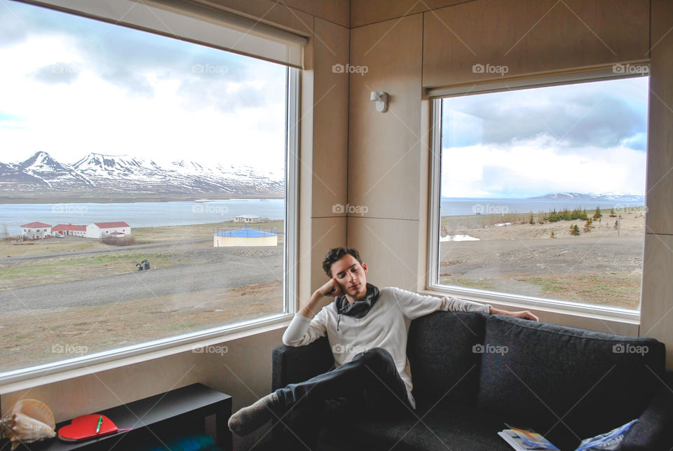 Young man relaxing on sofa