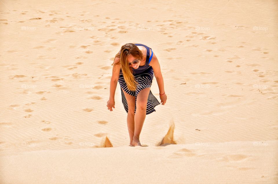 happiness in sandy dunes of corralejo on fuerteventura island