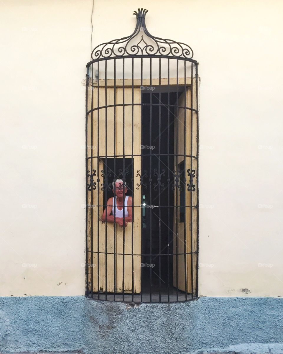 Cuban man in window 