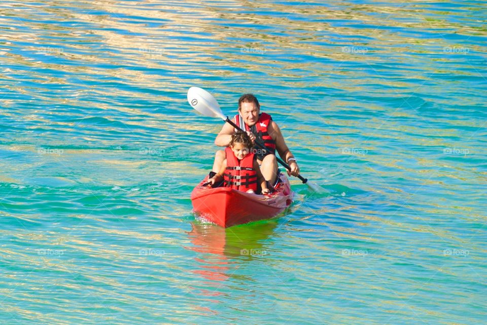 Father and daughter enjoying kayaking