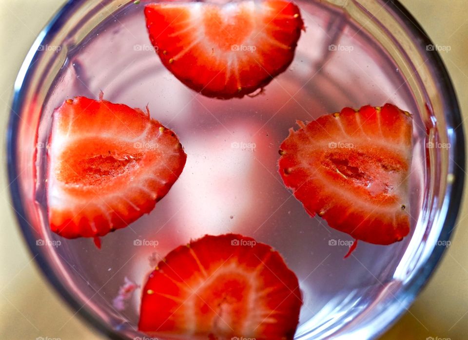 Strawberry floating in water