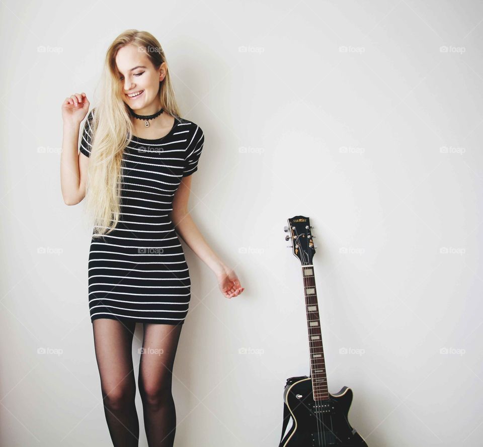 smiling girl and guitar