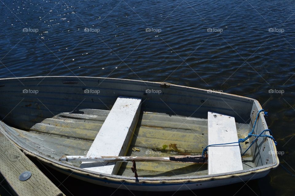 Old Rowboat Dinghy tied Stopping for an afternoon napto dock. Old Rowboat Dinghy tied Stopping for an afternoon napto dock