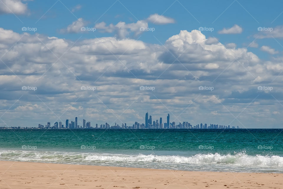 Australia ocean beach with the big city on the background