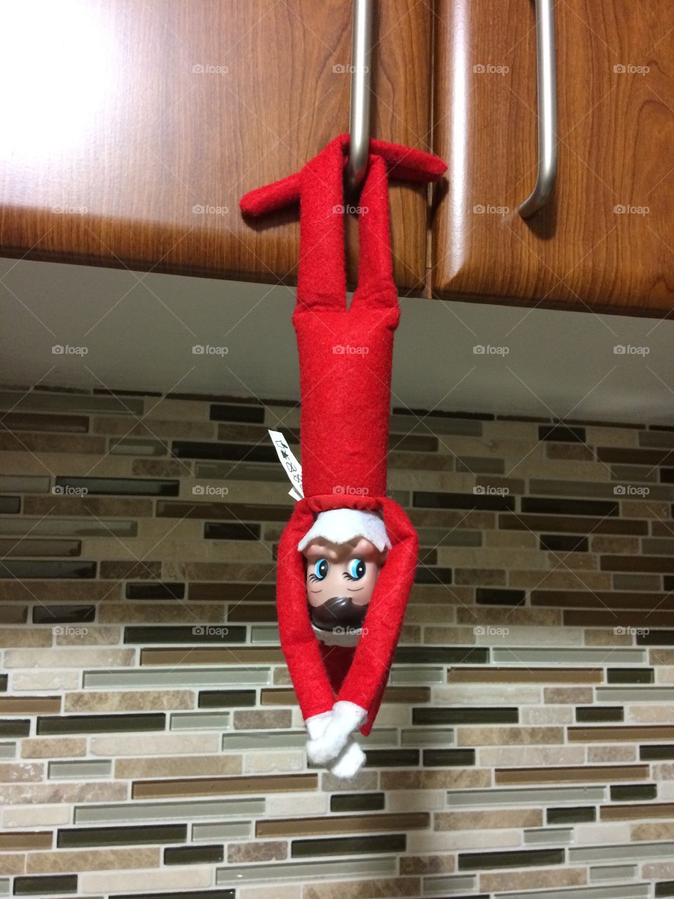 Elf Hanging from the cupboard 