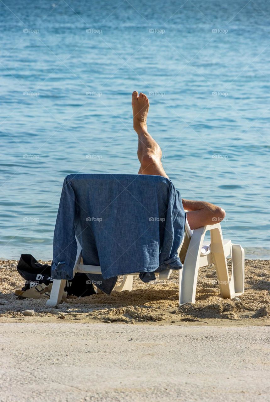 Someone's enjoying sunny day on the beach