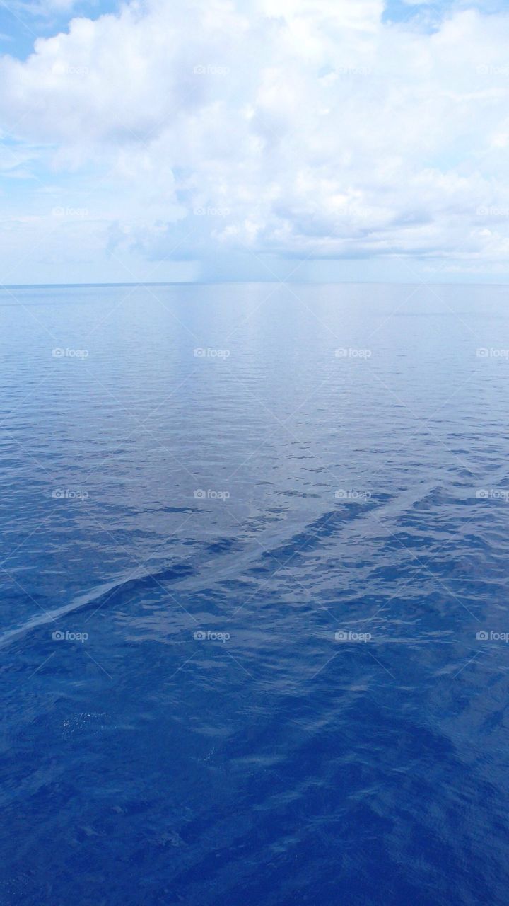 Ocean with rain clouds