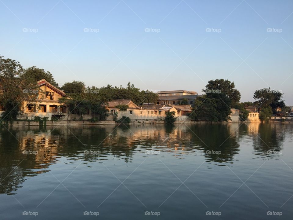 Houses in front of lake