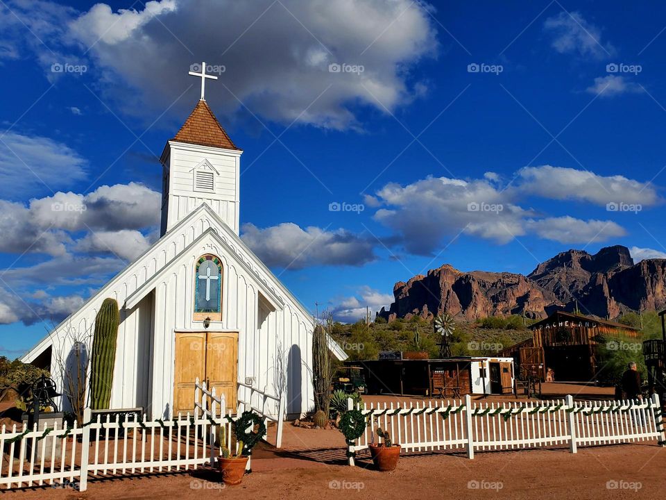 A movie prop church used in a 1960's Elvis Presley movie is framed by the beautiful Superstition Mountains near Phoenix Arizona