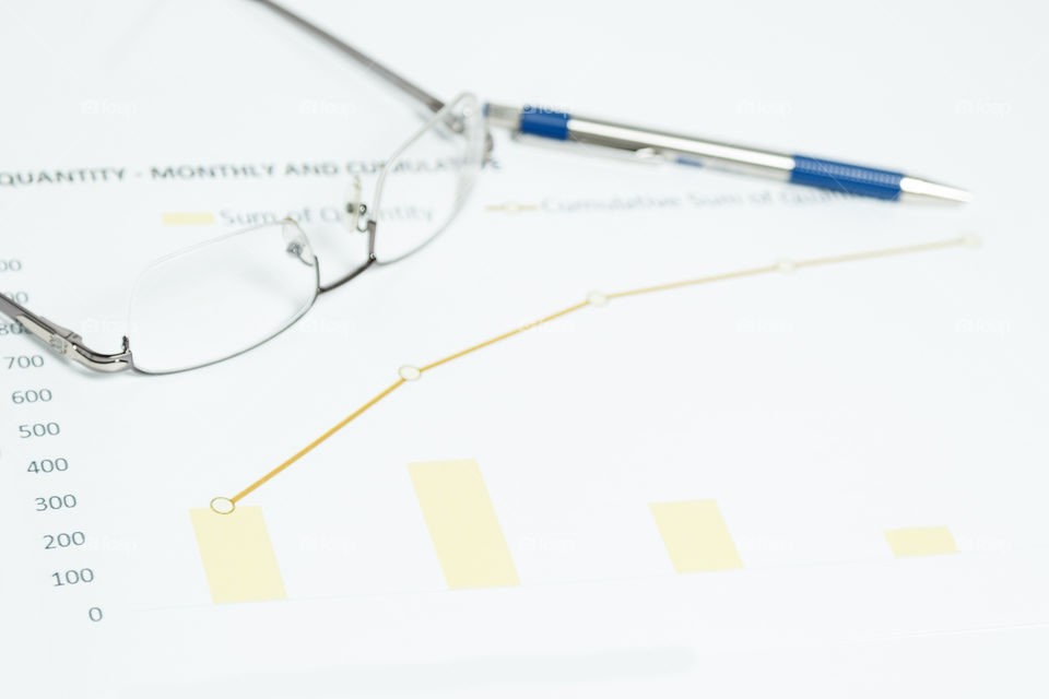 glasses, graph, and pen. business photograph