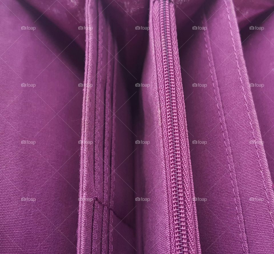 Detailed view of inside a ladies purple wallet