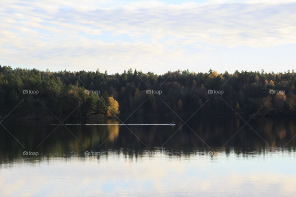 Autumn - canoeing on a calm lake