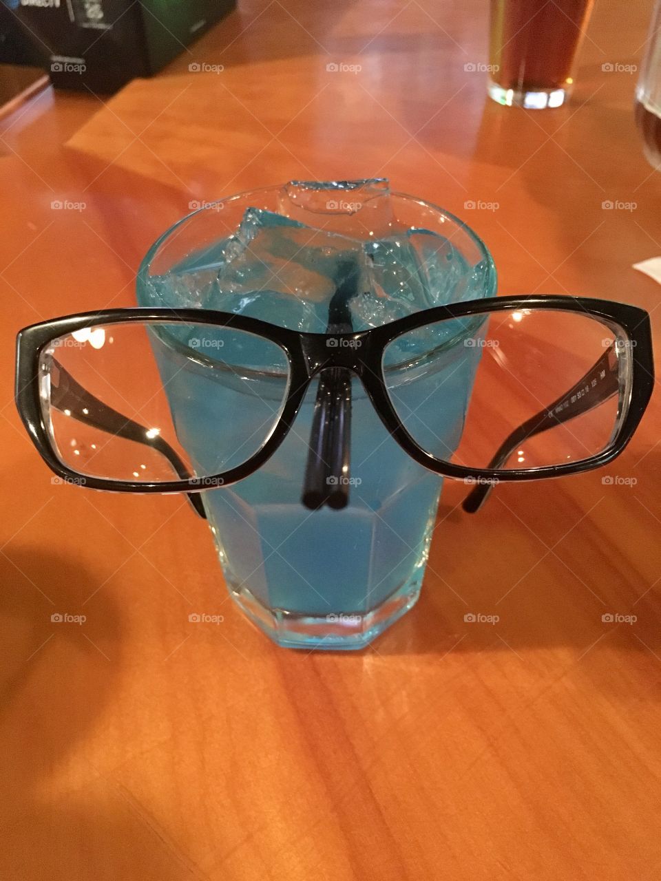 Glasses on a blue Long Island ice tea 