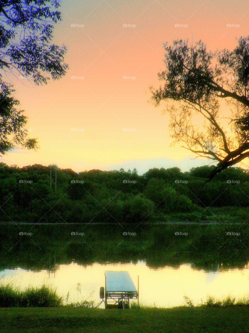 Serenity on a summer evening. Evening sunset along a quite River 