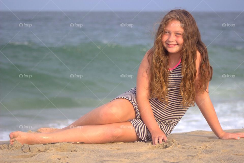 Smiling girl posing at beach