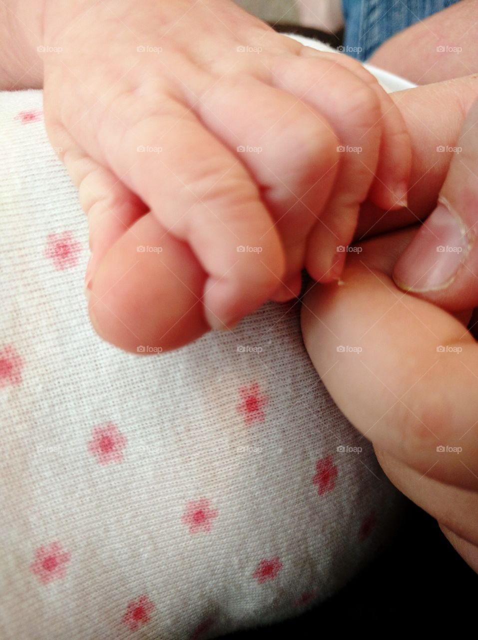 Baby holding Finger