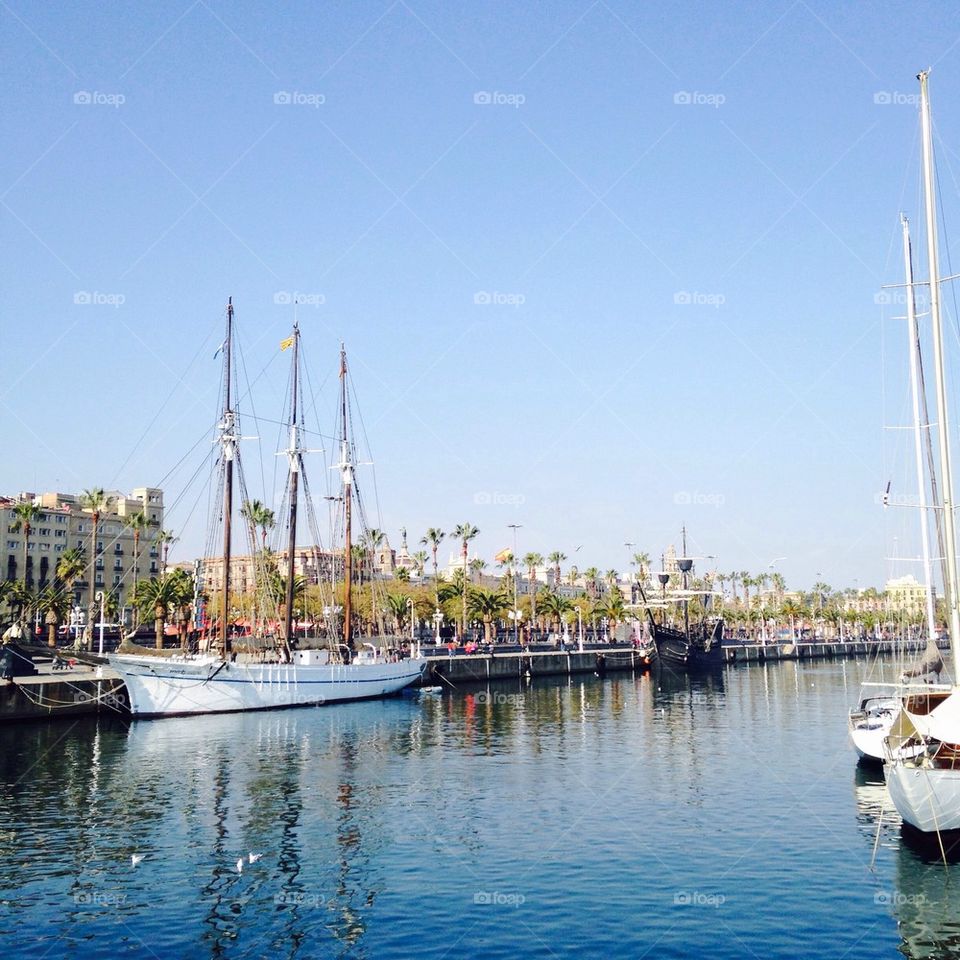 Sail boat moored at dock