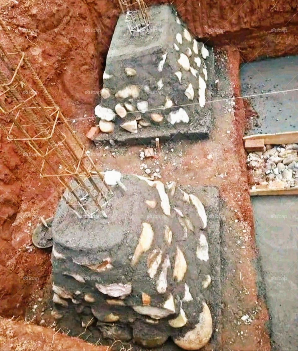 The underground pillar of a bungalow is being prepared.