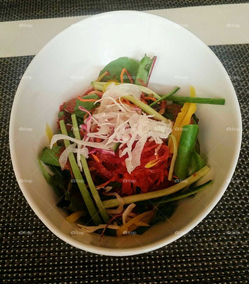 Colorful japanese beet salad in a large round bowl