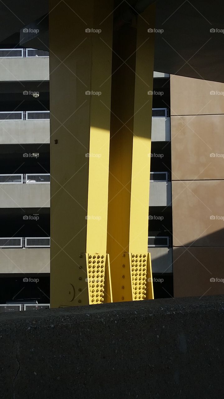 yellow support columns on one of Pittsburgh's many bridges