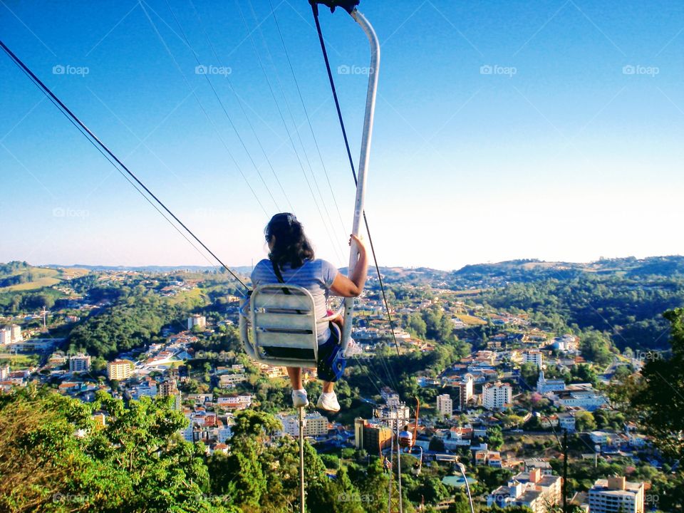 Freedom moment -Mother And Daughter Crossing Cable Car City