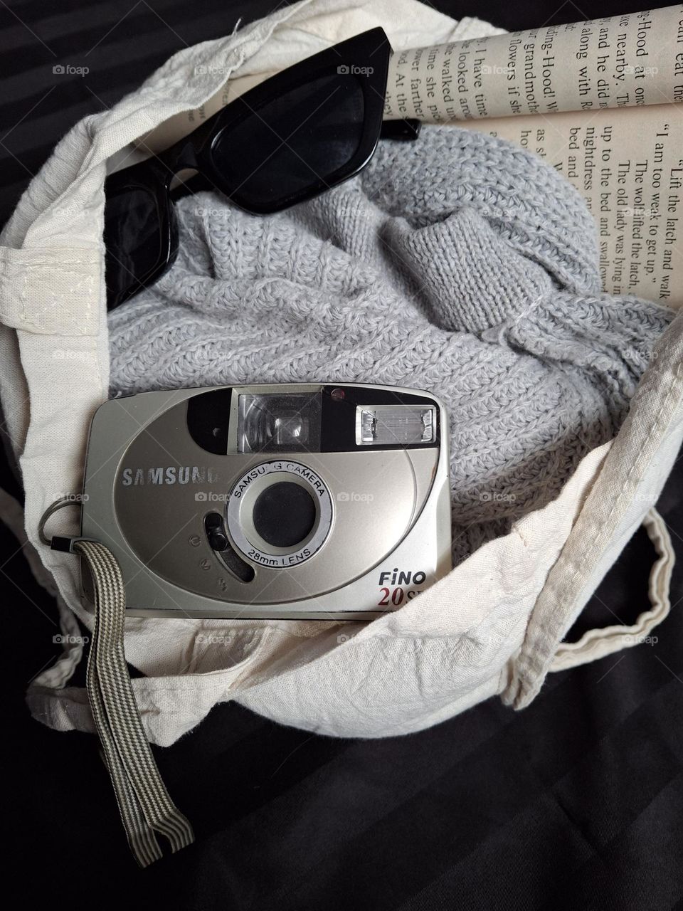 vintage retro camera with woven retro golf in eco bag