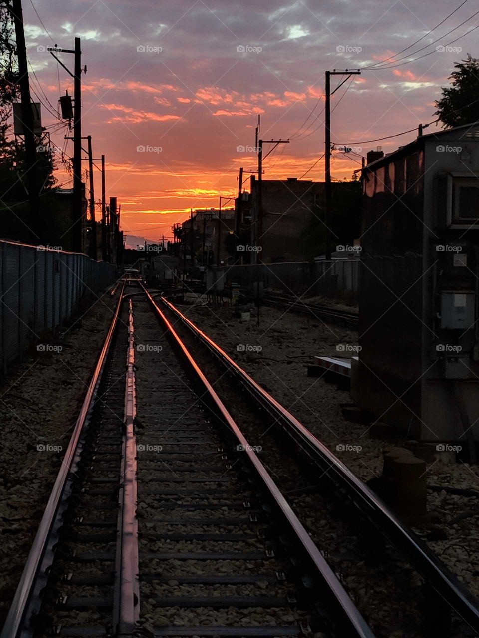 golden sunset over railroad tracks