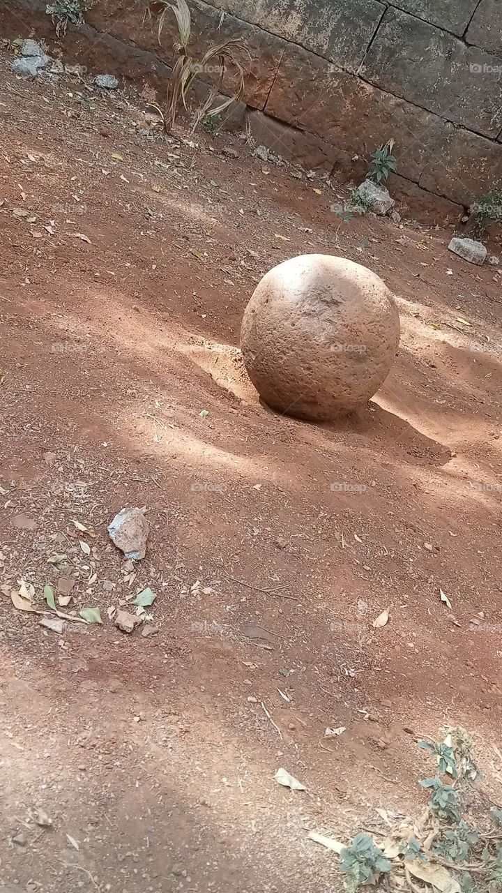 Round holy stone at temple.