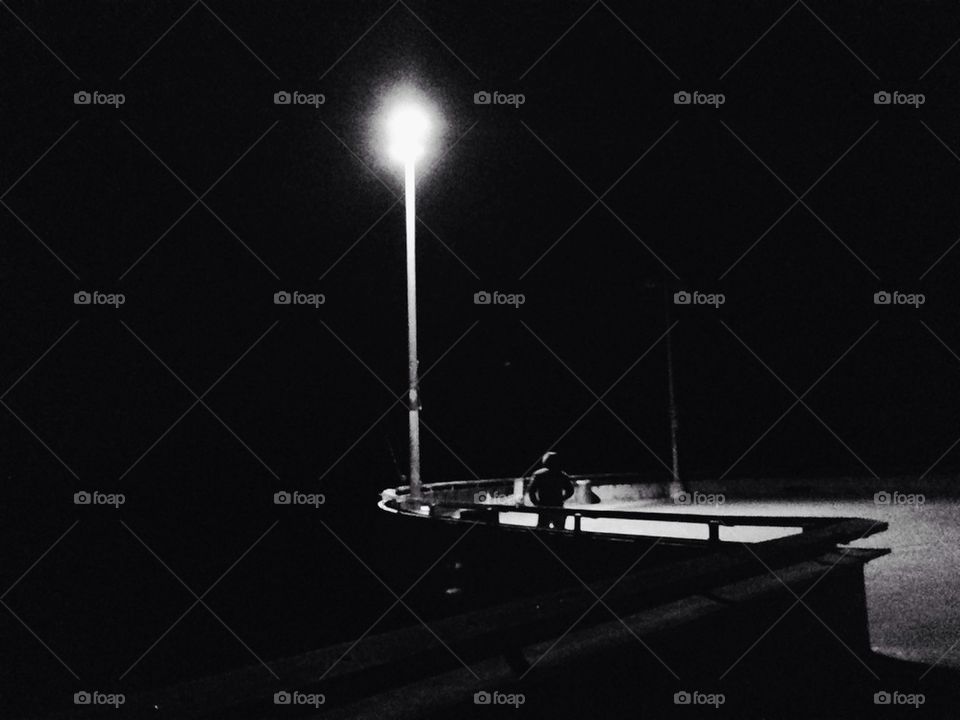 Lone man on pier