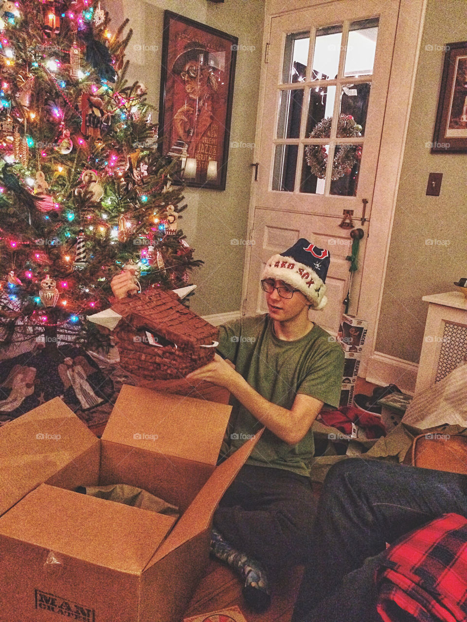 Man decorating house during christmas