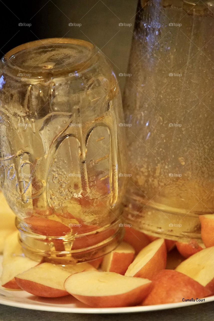 Empty honey jars on apples