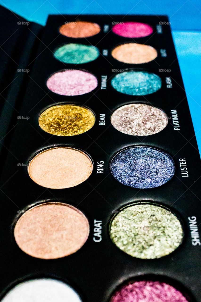 All glammed up with so many colors! A brightly colored glittery eye shadow pallet.