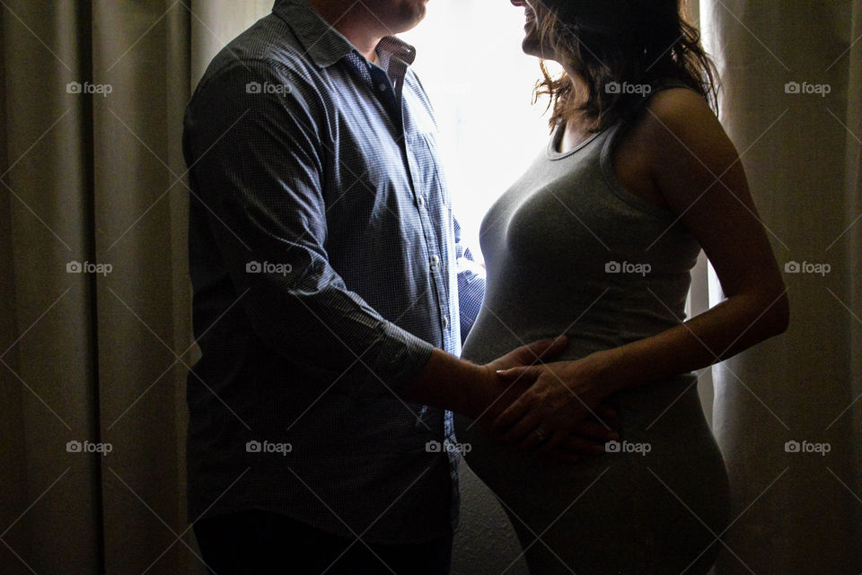 Close-up of a pregnant woman with her husband