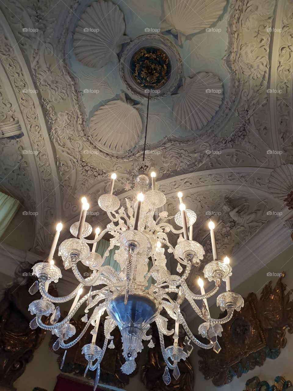 Murano glass chandelier and beautiful ceiling mouldings