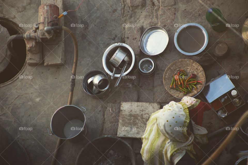 A women cooking a midday meal in India.