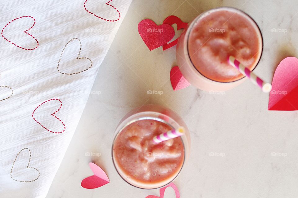 Sweet pink Valentine's Day fruit smoothies.