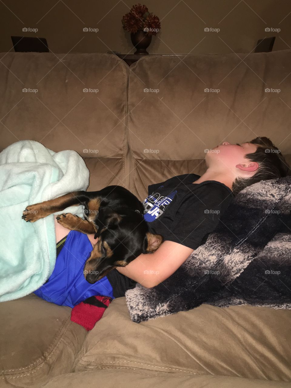 Boy resting with his dog