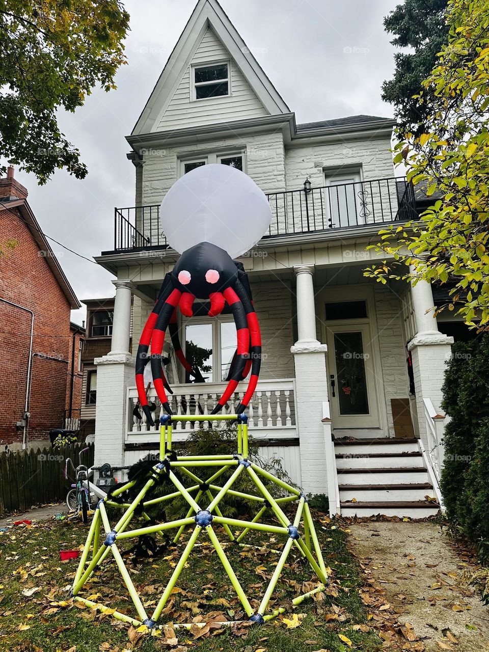 Halloween decorations and celebration in Toronto, Ontario. Ghosts, witches and skeletons. Creative art. Autumn, fall city landscape.