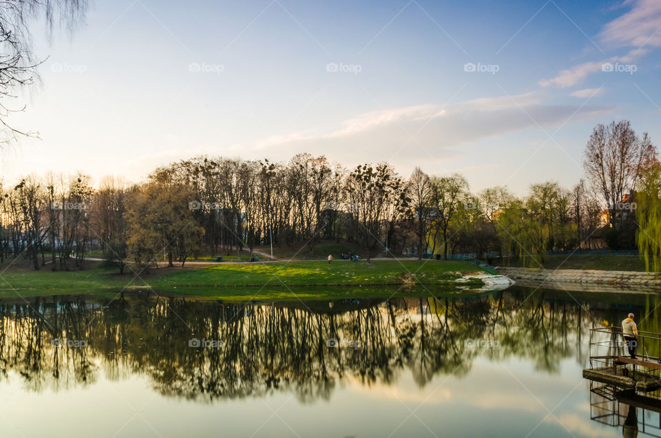 city park with lake in the spring season