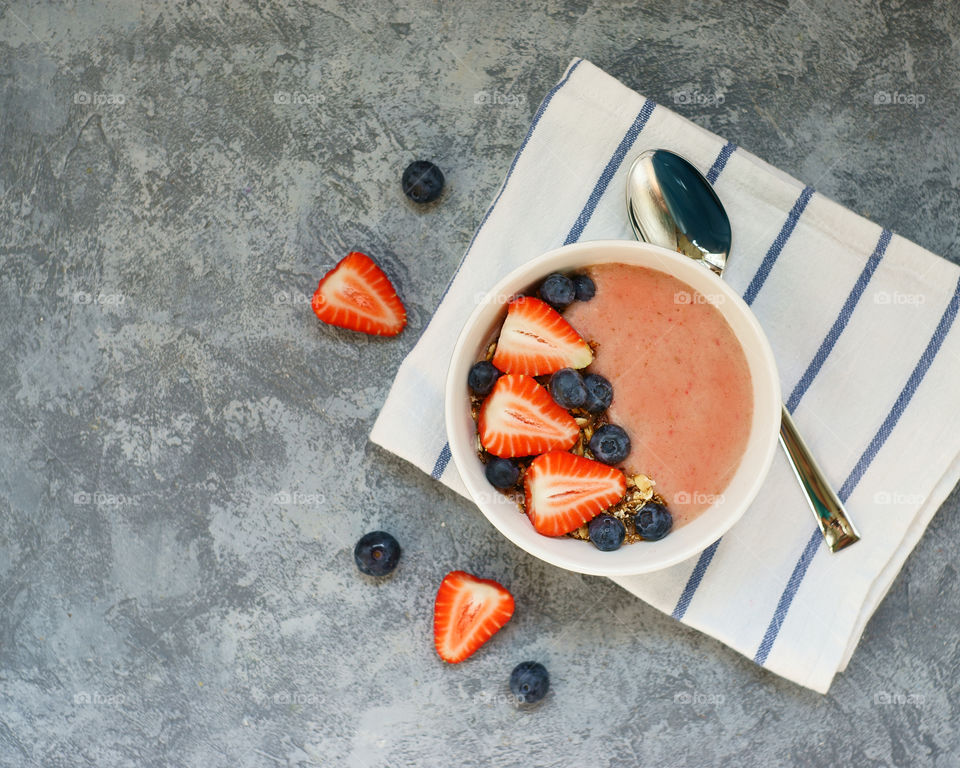 Healthy fruit berries smoothie in bowl