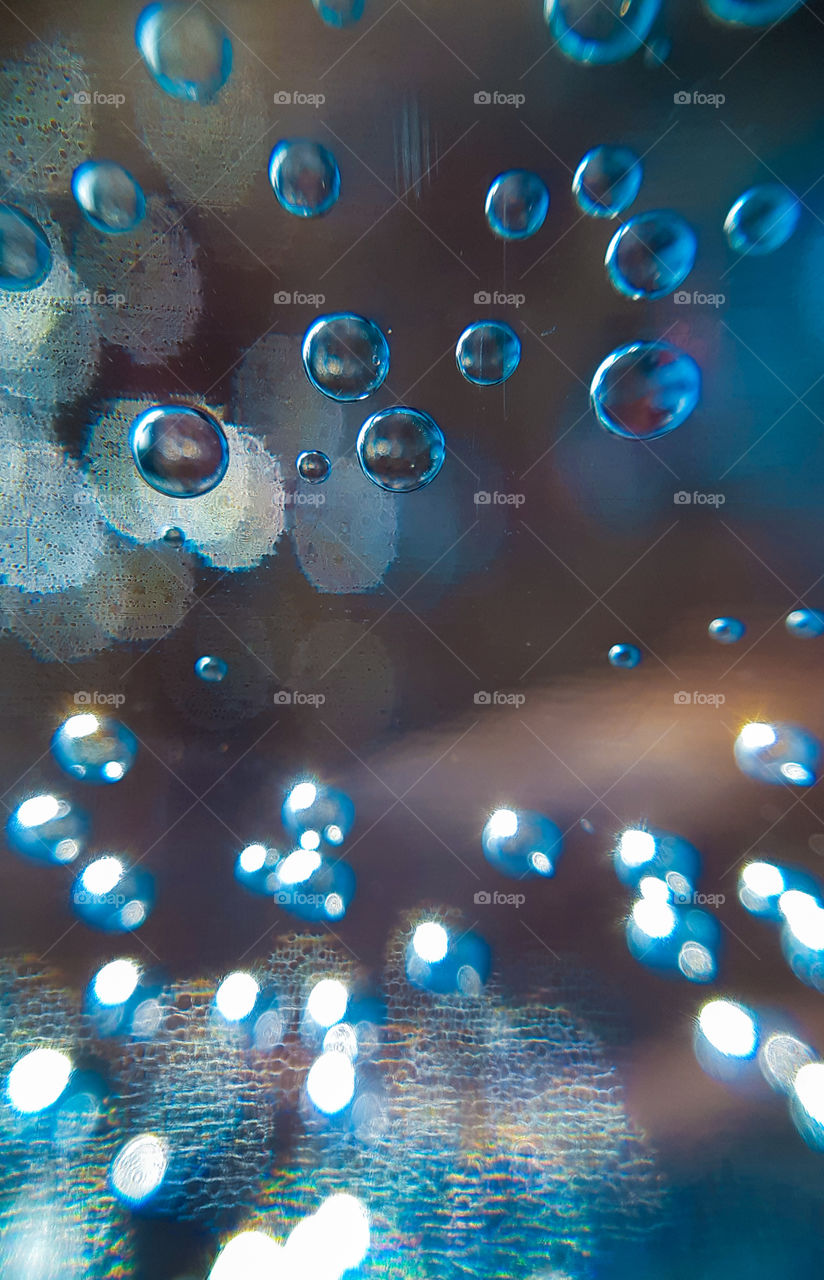 macrophoto of the bottle (water with gas) made with phone