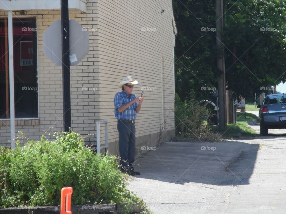 beam me up Scotty. This is a picture of a local merchant out making a phone call