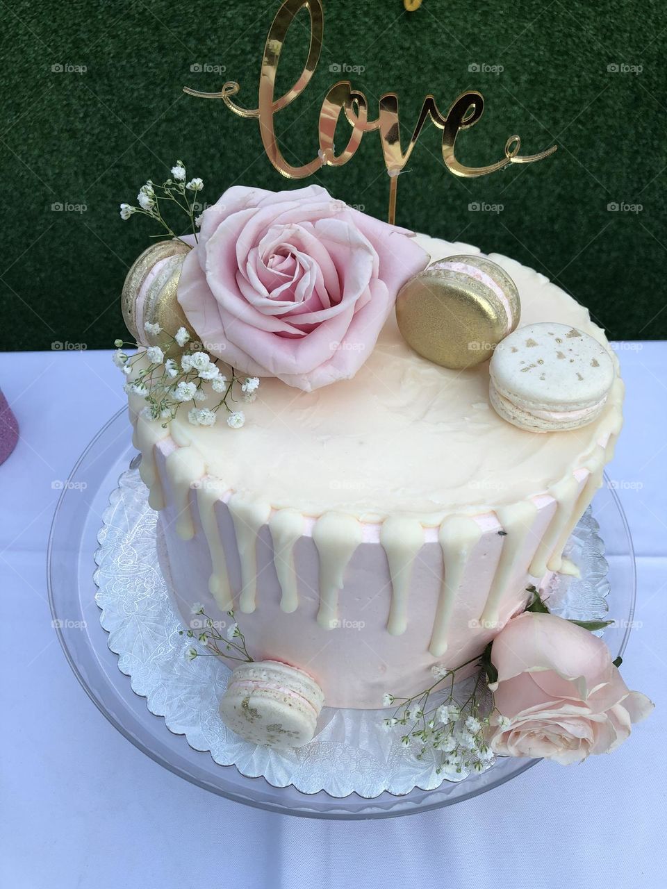Delicately decorated bridal shower cake Love