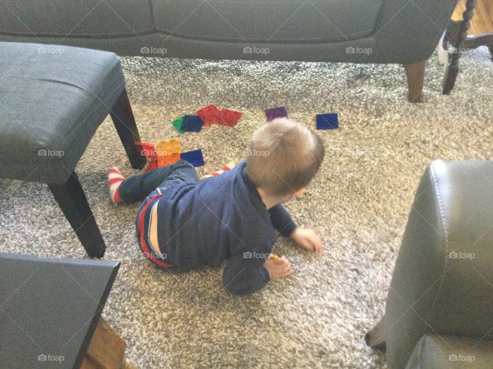 A child gets creative with some building blocks 