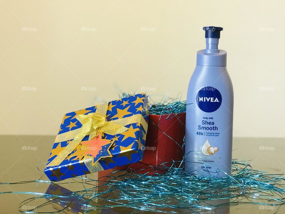 Nivea shea smooth lotion with blue and red gift box labeled as FOR YOU.