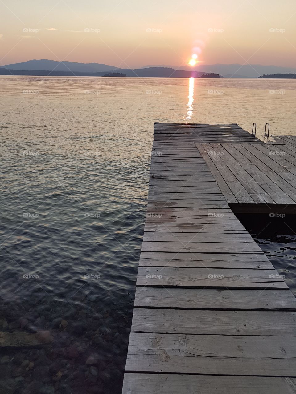 Lake boat dock at sunset