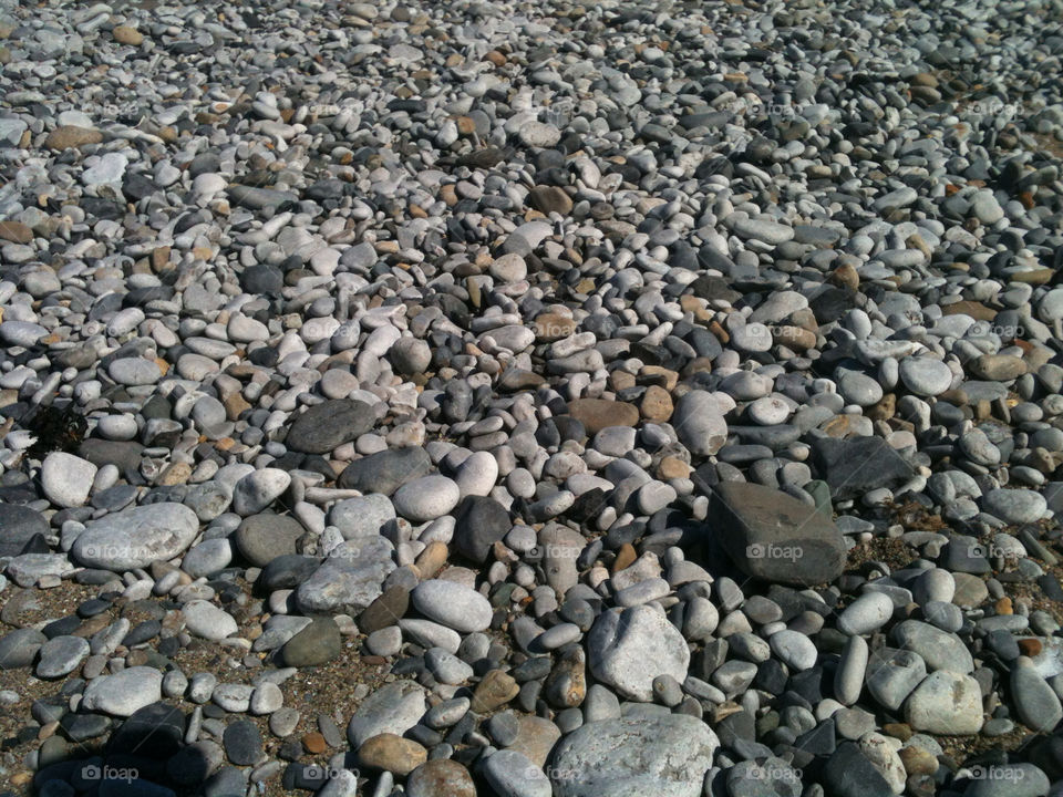 beach united kingdom stones rocks by gregmanchester