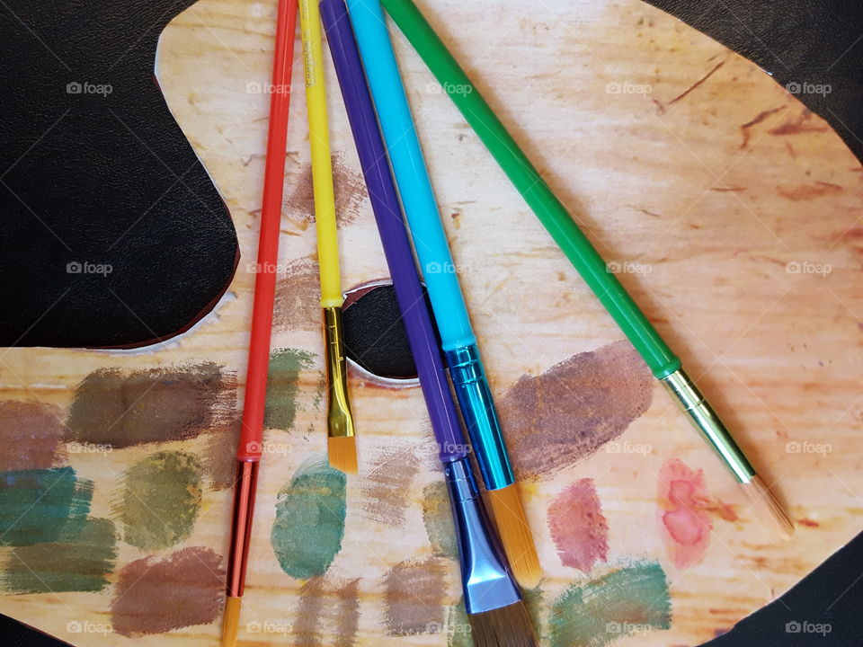 Close-up of paintbrushes on palette